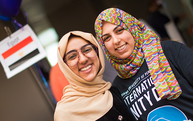 Two international students at the annual International Unity Day celebration