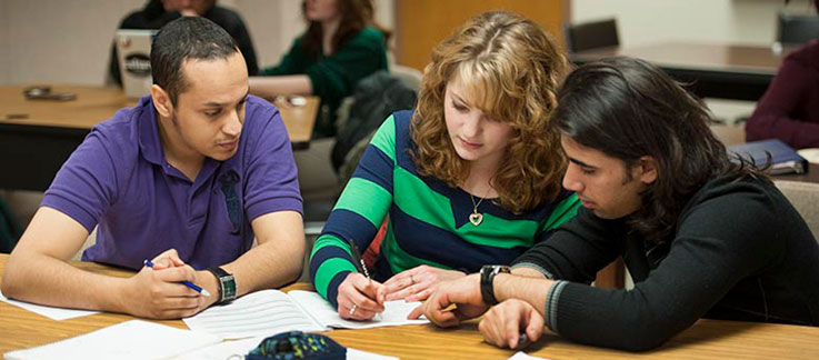 Students studying together in a classroom 