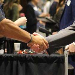 Closeup of two people shaking hands