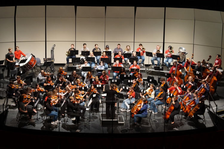 The IUP Symphony rehearsing on the stage of Fisher Auditorium
