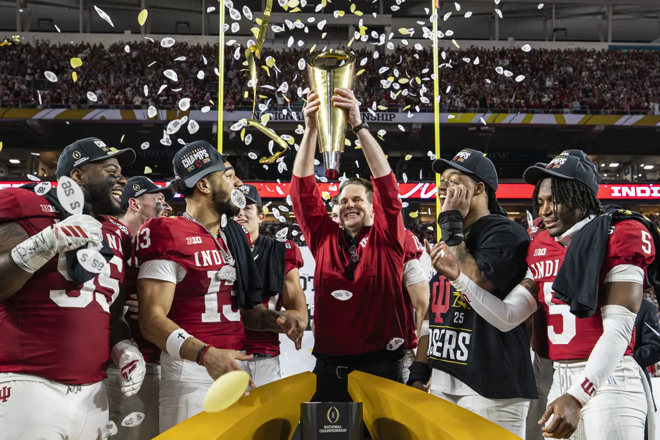 Curt Cignetti with the national championship trophy after his Hoosiers defeated the Miami Hurricanes in January