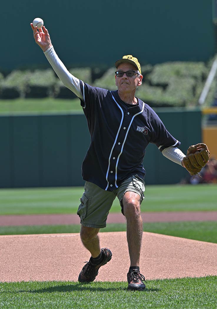 Mark Mahoney delivering the first pitch