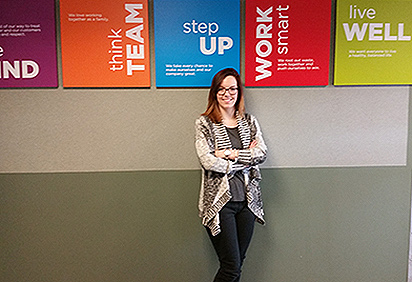 Jamie Czech stands in a hallway at Giant Eagle Corporate