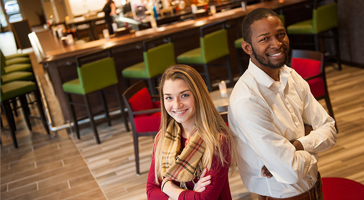 Two Hospitality students in a hotel lounge