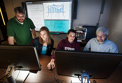 Students and a professor in the High Performance Computing Lab