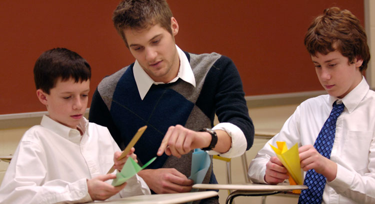 Math student teacher and two students 