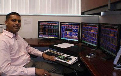 Tejash Patel, an MBA alumnus, is pictured using the Bloomberg Terminal in the Finance and Legal Studies Department.