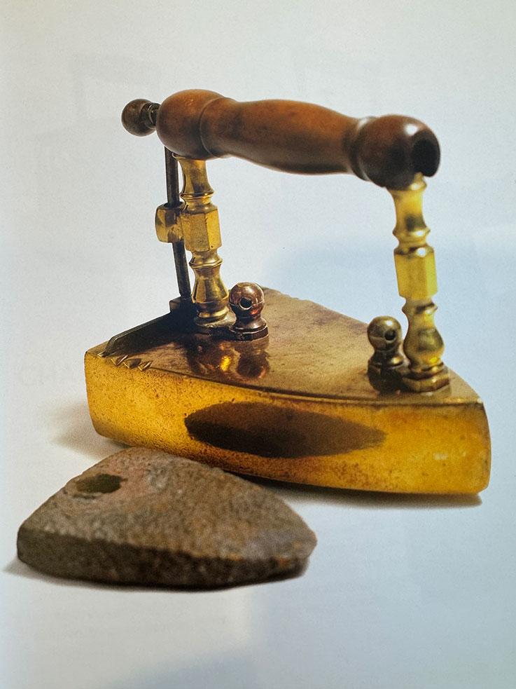 a brass antique pressing iron