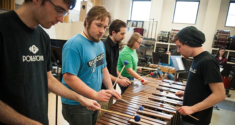 Students rehearse on marimbas