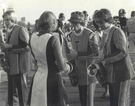 Band members on the field, black and white photo.