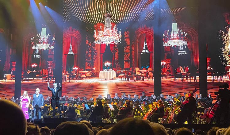 View of the full stage with Andrea Bocelli singing, orchestra playing behind them, and the IUP student chorus singing