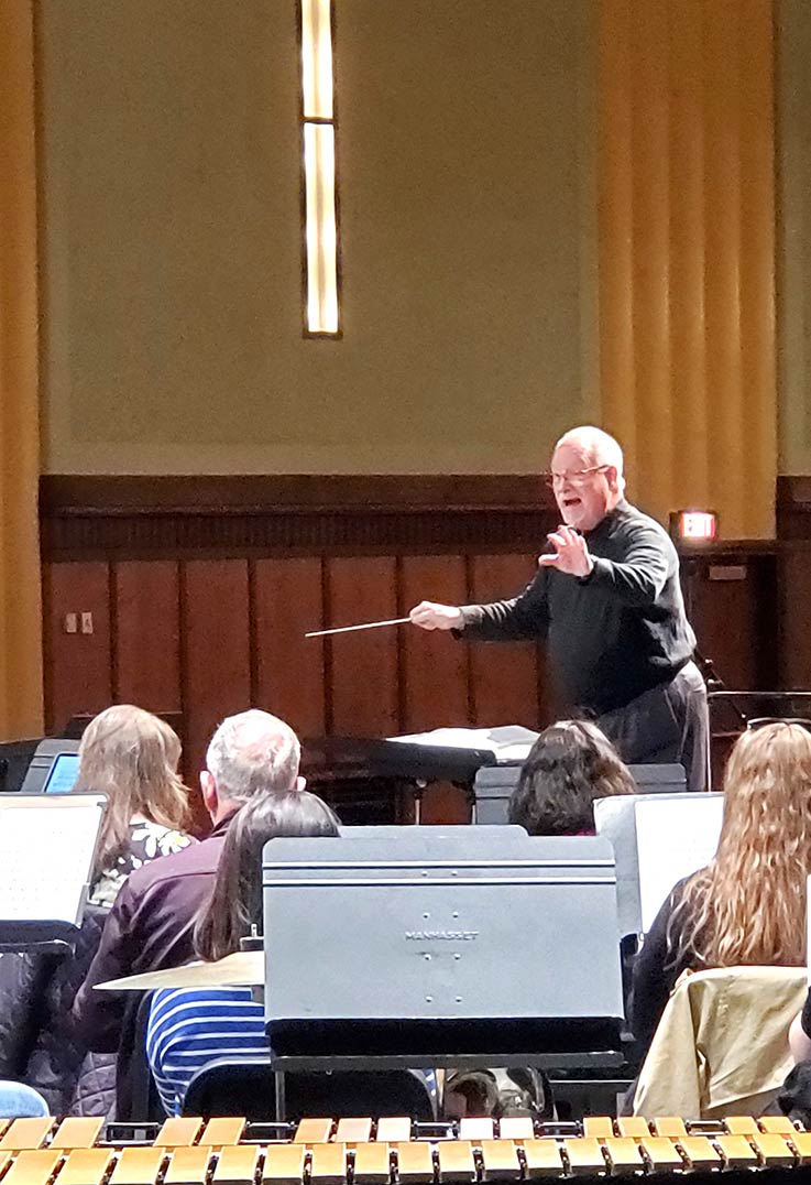 Professor emeritus Jack Stamp led the ensemble during rehearsal.
