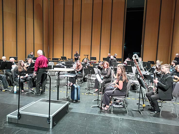 The Keystone Wind Ensemble prepares for a performance at the Texas Bandmasters Association conference.