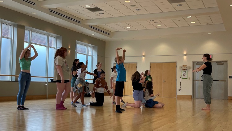 IUP alum and former Footlight Player Brianna Adkins leads a movement workshop for Footlight Players.