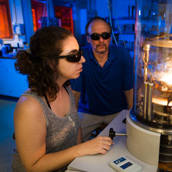 Greg Kennings and a student work in the lab