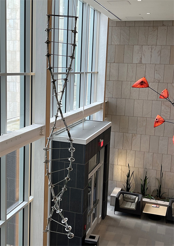 Sculpture made of Bunsen burners, replicating double helix of DNA