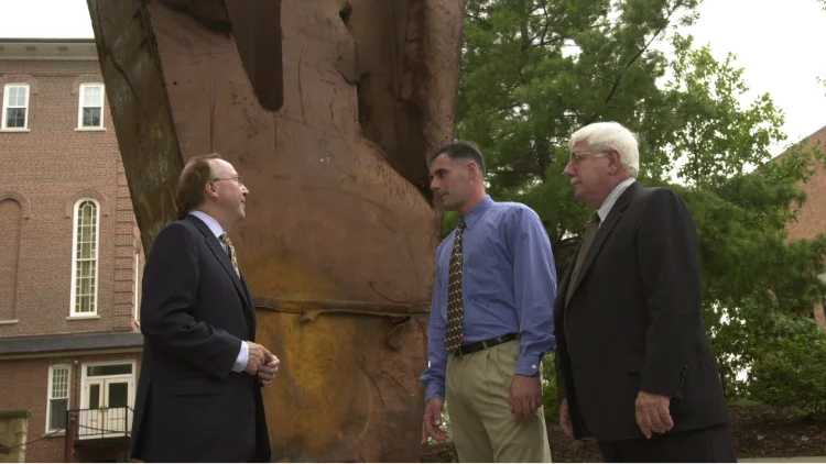 President Lawrence Pettit, Nathan Kovalchick, and Joe Kovalchick after the dedication of the World Trade Center remnant, which is on long-term loan from the Kovalchick family. 