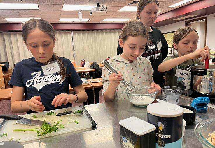 Eliza Petrillo, Olivia Kellerman, Emma Brooks; in back is IUP dietetics student Lana Fairman 