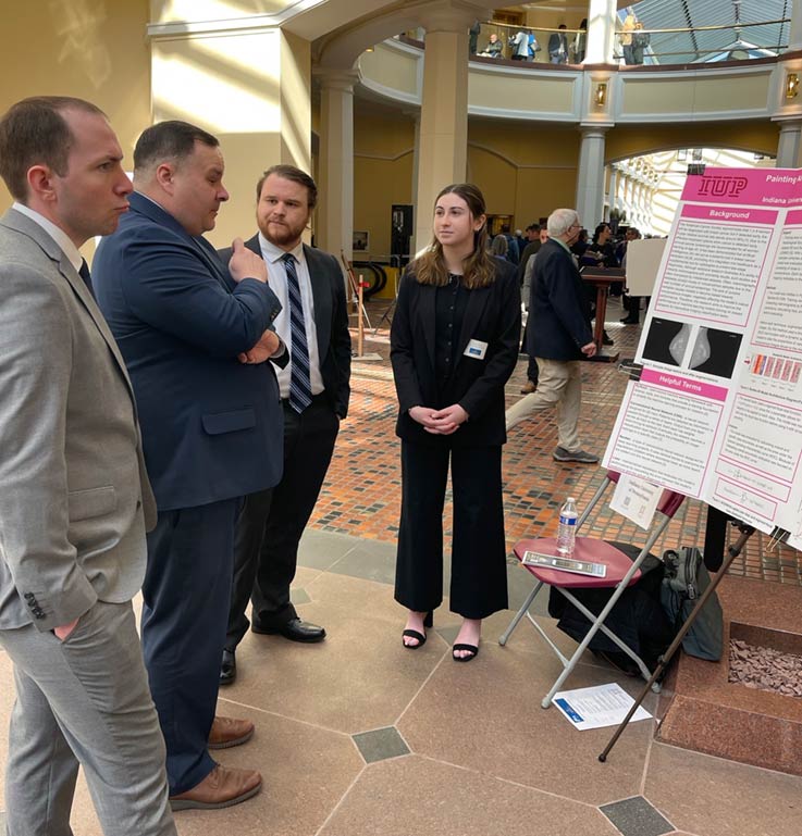 Aaron Riggleman, Neal Lasher, IUP computer science faculty member Sam Grieggs, Megan Seaman