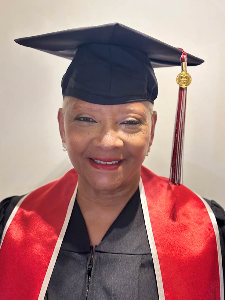 Aretha Swift in her graduation cap and gown