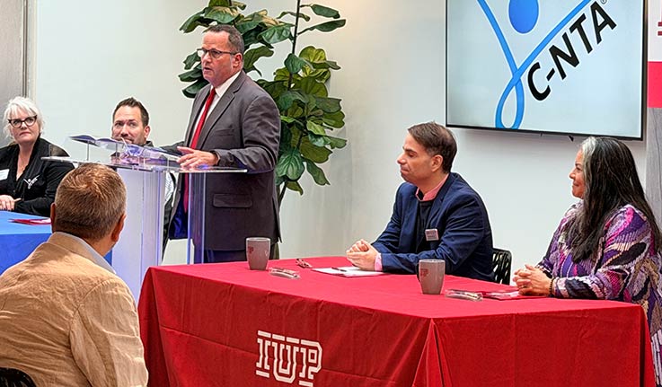 CNTA Clinical Director Angie Richard, CNTA CEO Jesper Nielson, Cambria County Commissioner Tom Chernisky (at podium), IUP COM Associate Founding Dean for Clinical Affairs and Graduate Medical Education Ryan Smith; IUP COM Founding Dean Miko Rose