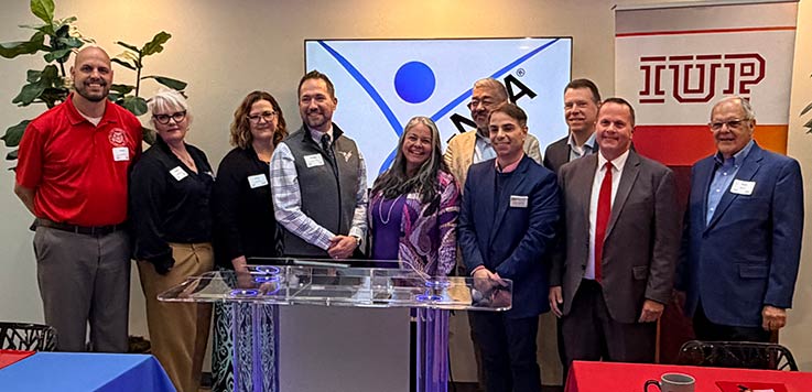 Cambria County Commissioner Scott Hunt, CNTA Clinical Director Angie Richard, CNTA President Amy Croyle Nielson, CNTA CEO Jesper Nielson, IUP COM Founding Dean Miko Rose, IUP COM Founding Associate Dean of Pre-Clinical Affairs Luke Mortensen, IUP COM Associate Founding Dean for Clinical Affairs and Graduate Medical Education Ryan Smith, IUP COM Director of Admissions and Student Affairs Jamie Murphy, Cambria County Commissioner Tom Chernisky, IUP Distinguished Alumni Award recipient and IUP COM supporter Nick Jacobs.