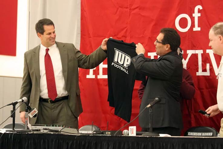 Curt Cignetti and Frank Condino stand together at a news conference
