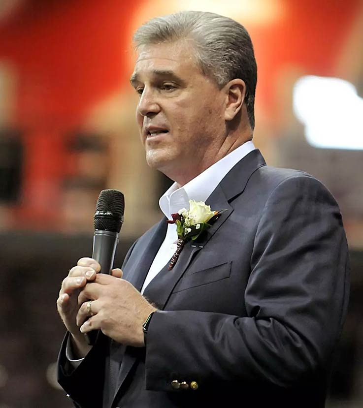 Dan Radakovich speaks into a microphone