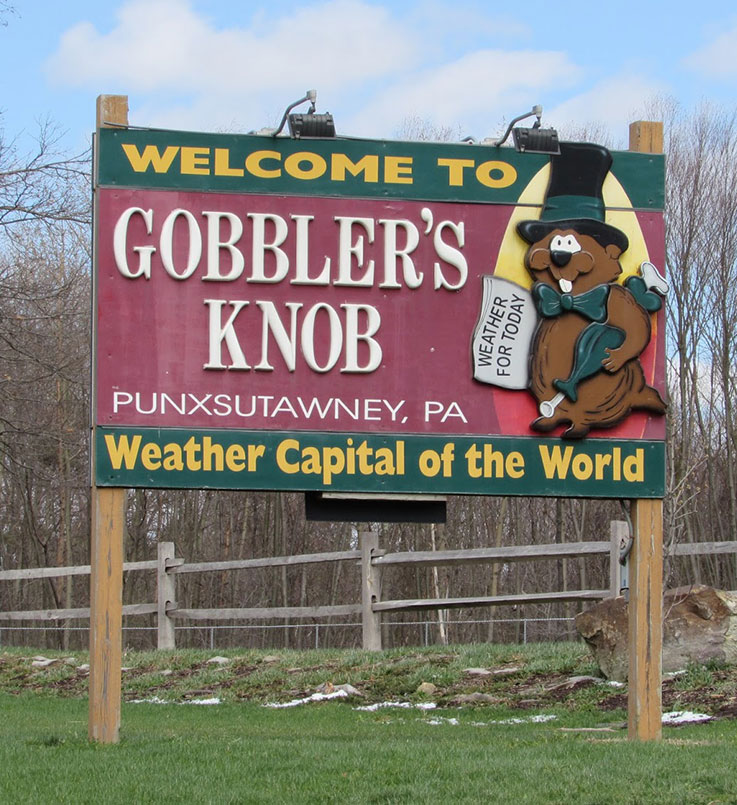 Roadsign sign showing Punxsutawney Phil that reads "Welcome to Gobbler's Knob, Weather Capital of the World"