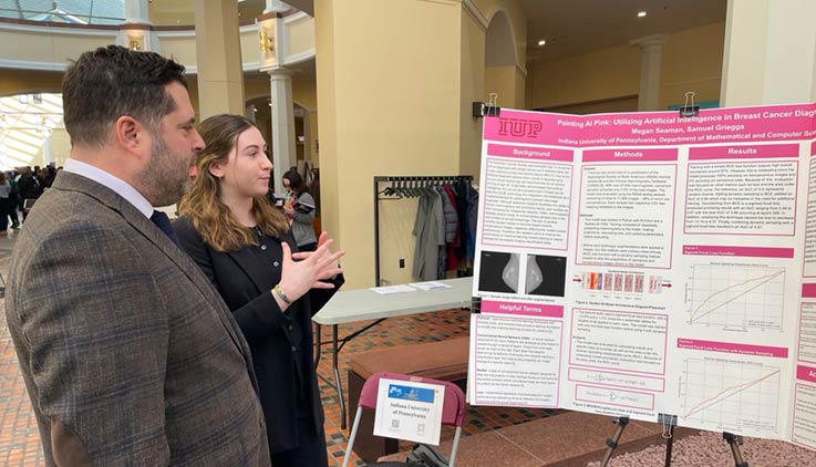 Megan Seaman presenting her research to Sen. Devlin Robinson