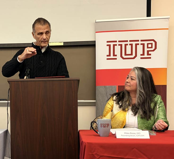 Interim CEO Tenor Health Foundation Peter Bastone at podium, and IUP proposed college of osteopathic medicine Founding Dean Miko Rose