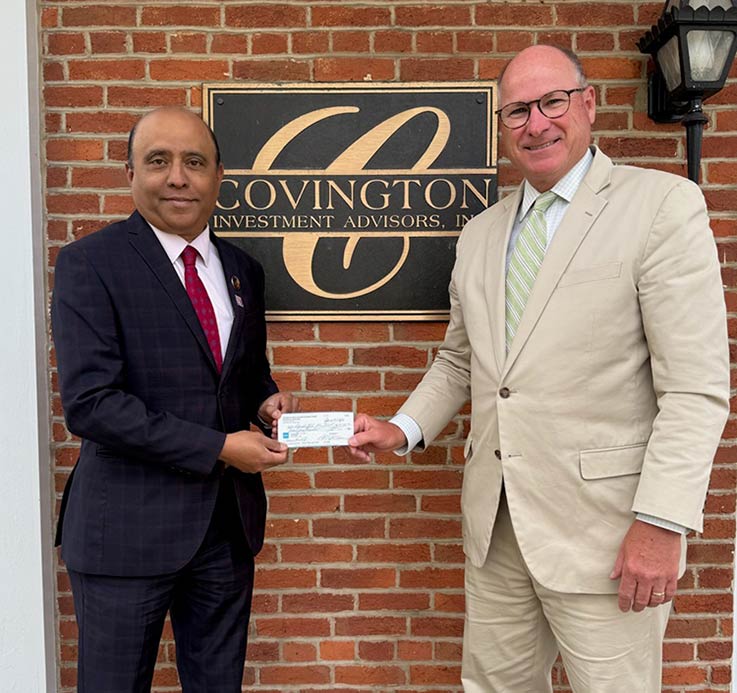 Eberly College of Business Dean Prashanth Bharadwaj and Patrick Wallace