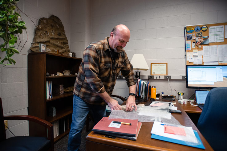 IUP geoscience professor, Steve Hovan, packs his personal belongings before leaving for his new role at the National Science Foundation (NSF) in Alexandria, Virginia