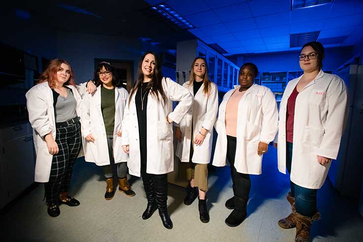 Christina Ruby, third from left, with undergraduate and graduate students from the Kopchick College