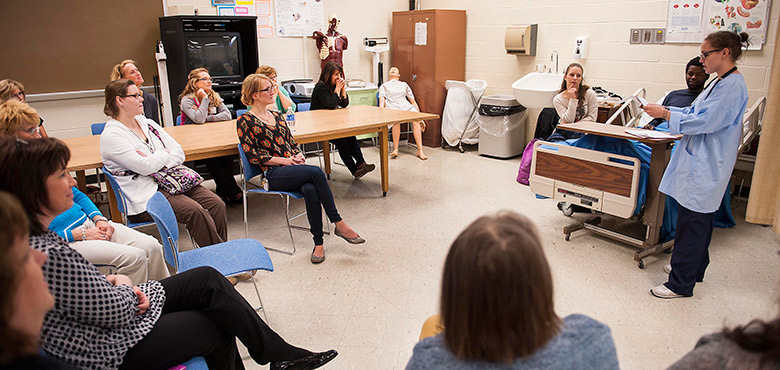 Nurses work with IUP theater students to practice skills