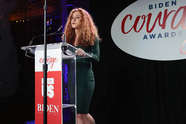 Adrianna Branin at the podium, accepting the 2019 Biden Courage Award