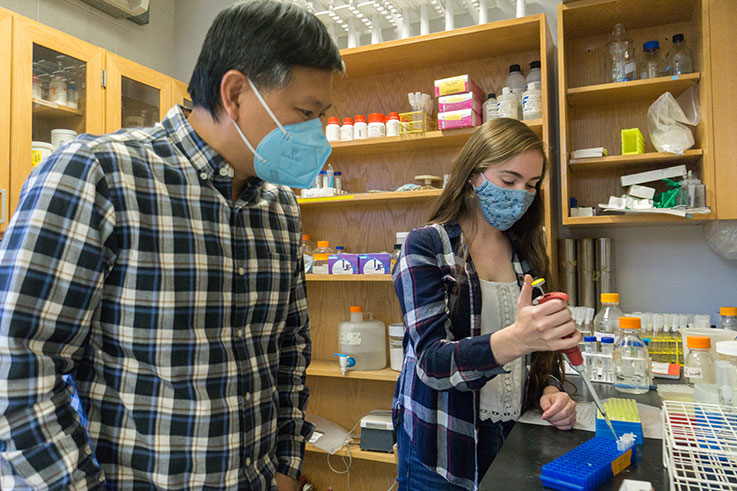 Sarah Grandinette, who was selected for IUP's 2021 Kopchick Summer Fellowship, works in the lab with faculty member Cuong Diep 