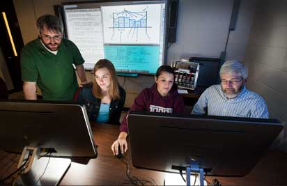 Professors John Chrispell and Ed Donley and two students use high performance computers