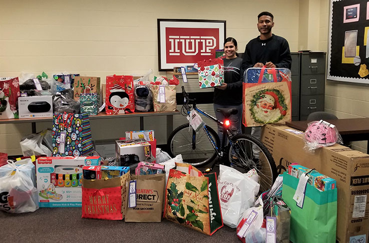 Students with some of the IUP Angels Wings' program donations for 2019