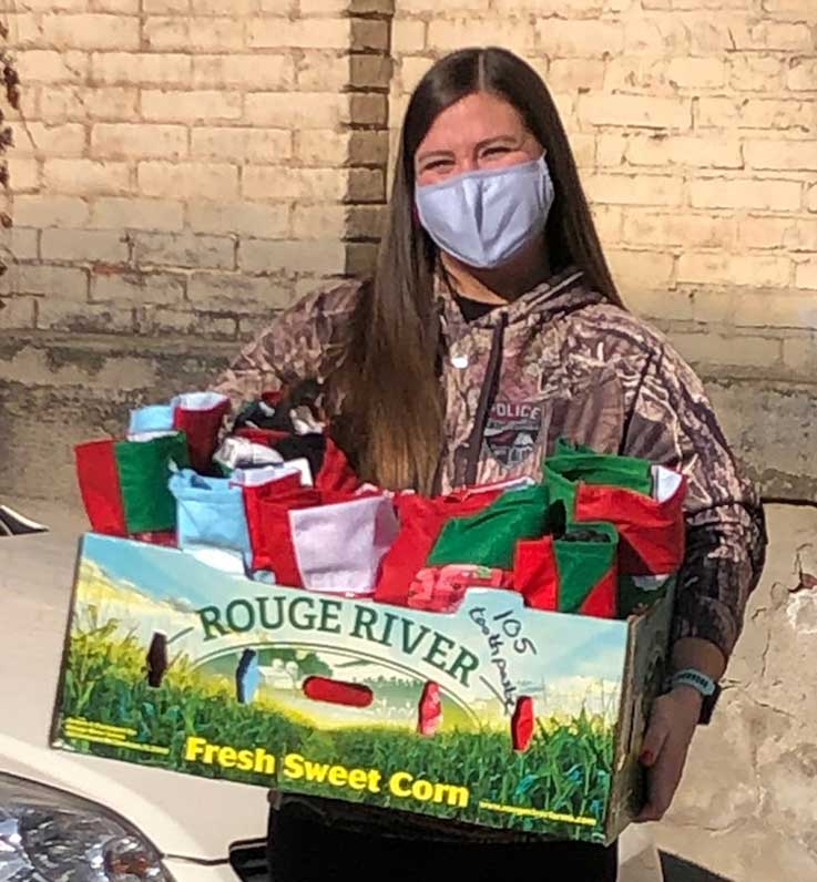 Kristin Squires with box of stockings 