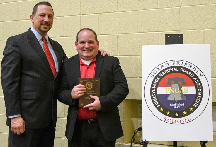At left, retired Brig. Gen. George Schwartz, chairman of the PNGAS Education Action Council, congratulates IUP's Dr. Cory Shay, director of the Military and Veteran's Resource Center. At left, retired Brig. Gen. George Schwartz, chairman of the PNGAS Education Action Council, congratulates IUP's Dr. Cory Shay, director of the Military and Veteran's Resource Center.