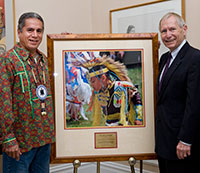 Clifton Pembleton, left, and David Werner, IUP interim president, with the photo the Native American Awareness Council will present to Werner on November 12 (Keith Boyer photo)