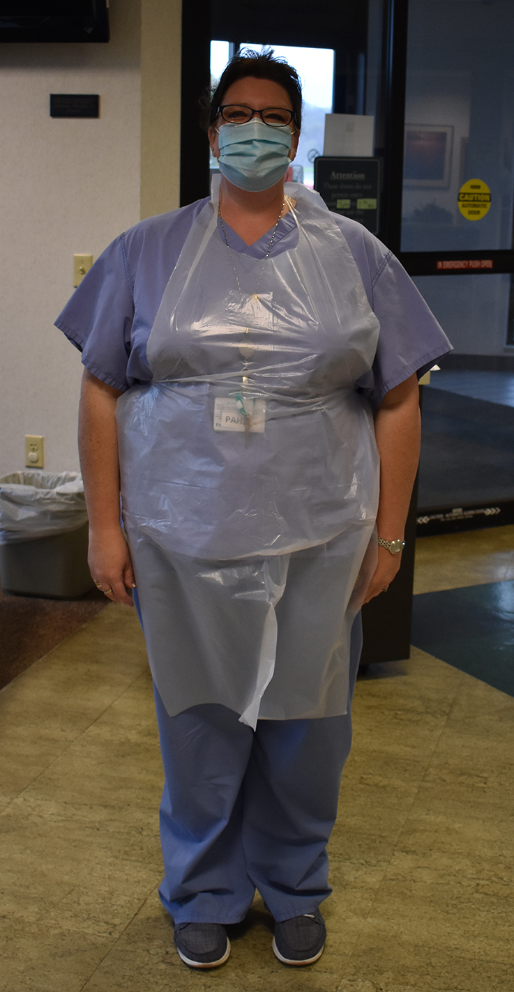 Punxsutawney Area Hospital employee in a protective apron donated by IUP 