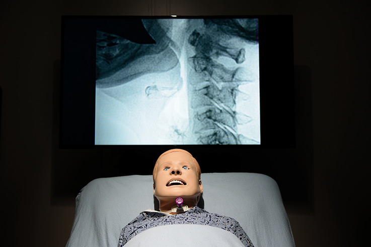 Kevin is outfitted with a tracheostomy, dentures, a stomach, and lungs. He can experience aspiration during a “swallow.” 