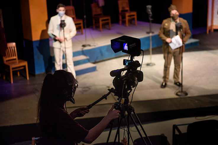 Riley Guers, a junior theater major, plays the role of Leonato, and Addison “Addie” Minich, a sophomore musical theater major, plays the role of Borachio. A student from Communications Media operates the video camera to live stream the show.