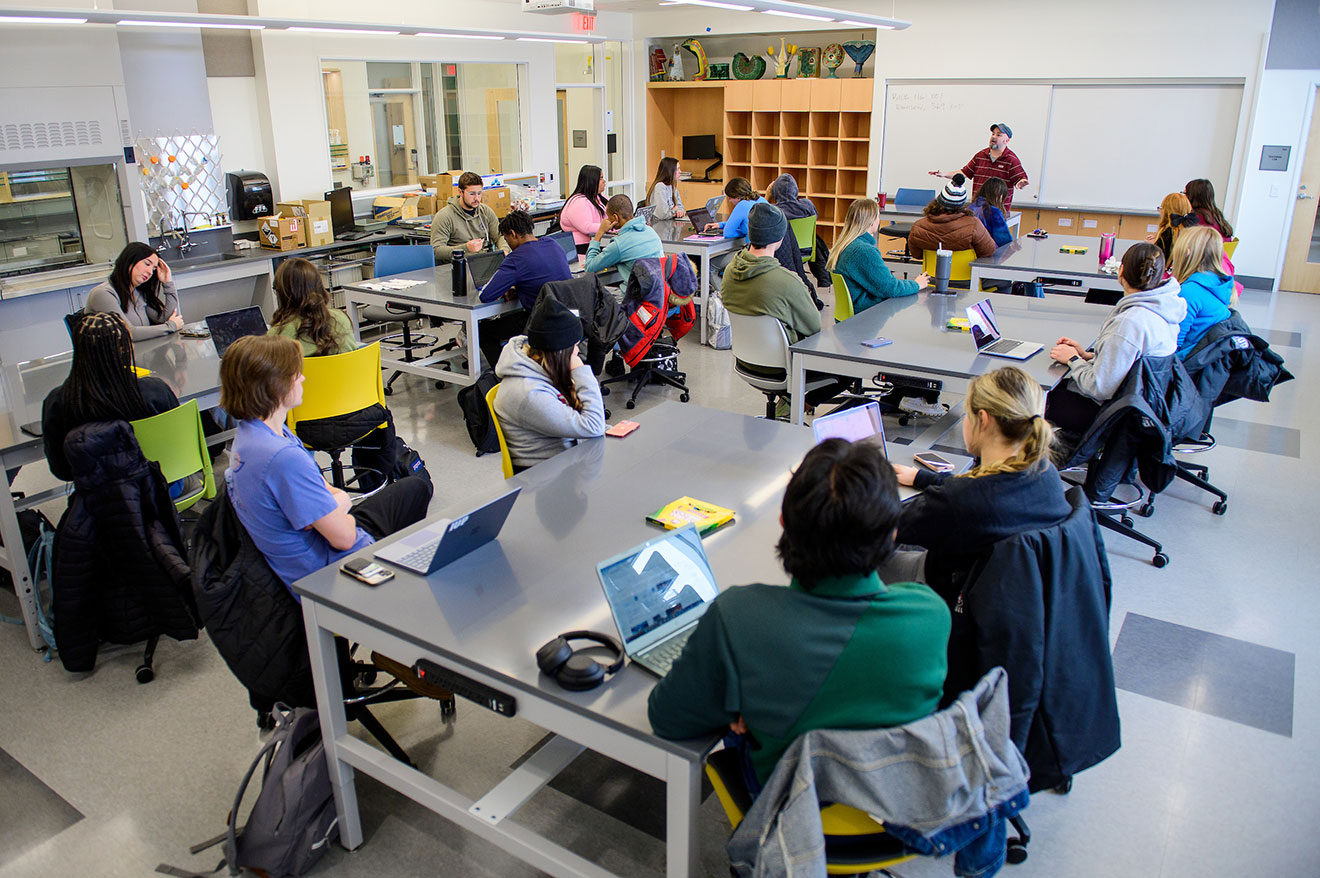 Josiah Townsend leads a human genetics class on the third floor.