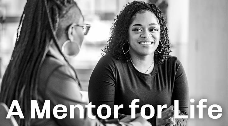 Black and white photo of Malaika Turner and Rachel Pettiford talking with the words "A Mentor for Life" overtop.