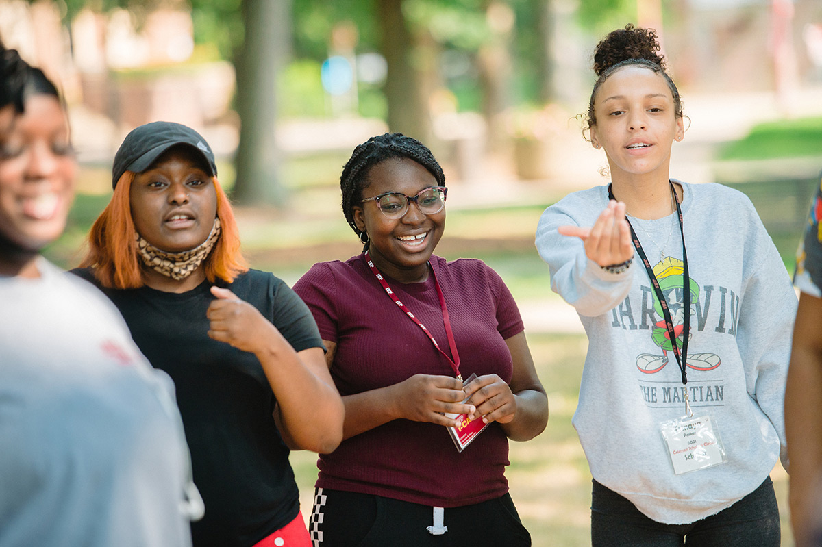Scholars participate in a team-building exercise in the Oak Grove.