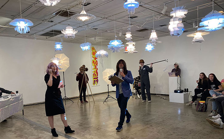 Judges and student designers inKipp Gallery during “Design Stars of IUP,” a mock television show presented in the style of a reality-TV design competition. 