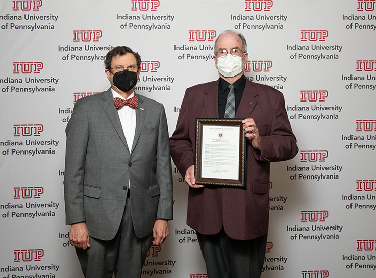 From left, IUP President Michael Driscoll; Dennis Cramer, a member of the fundraising committee for the Christian Dickinson Trombone Studio.